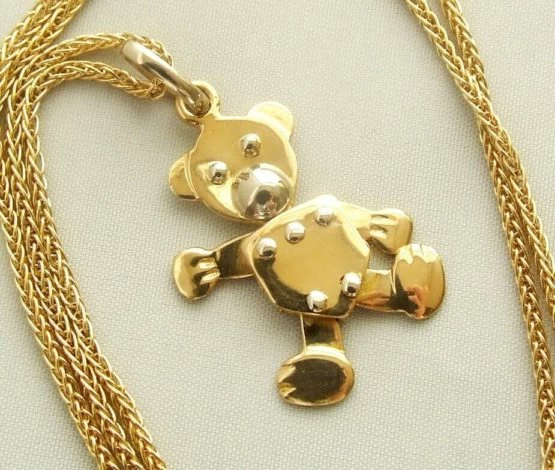 Gouden collier met teddybeer hanger