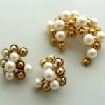 Gouden broche en oorclip set