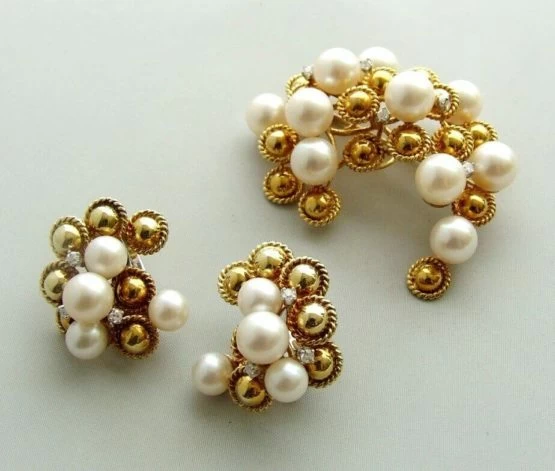 Gouden broche en oorclip set