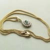 Gouden collier en hanger met smaragd en diamant