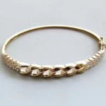 Christian gouden slavenarmband met zirkonia