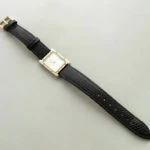 Goud op staal horloge met leren band Goud op staal horloge met leren band