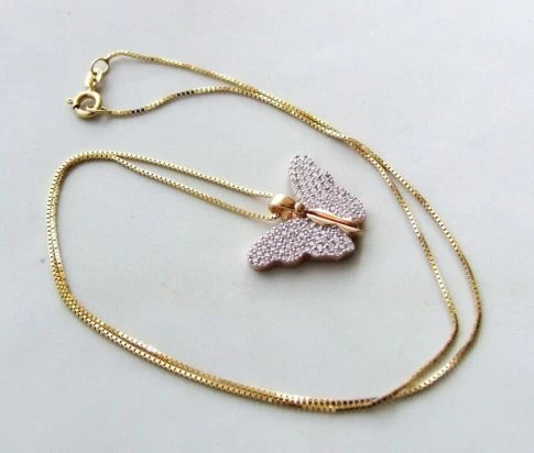 Gouden collier met vlinder hanger