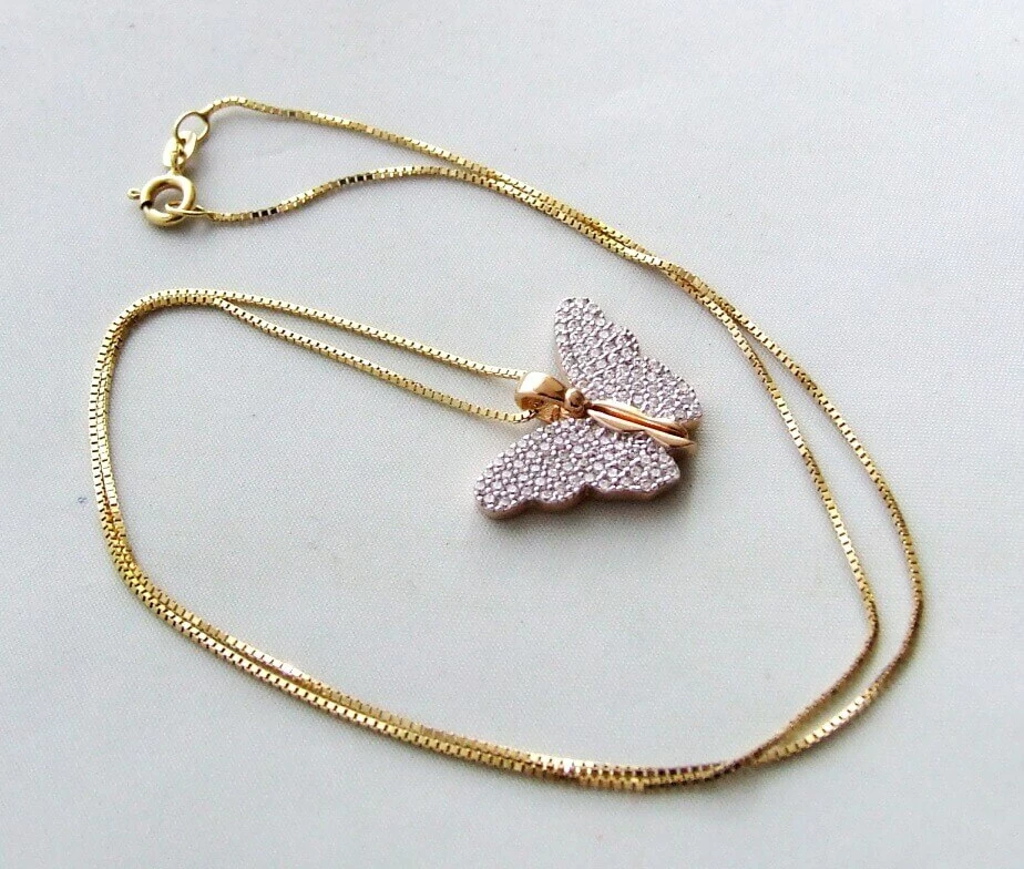 Gouden collier met vlinder hanger