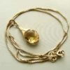 Gouden collier en hanger met citrien