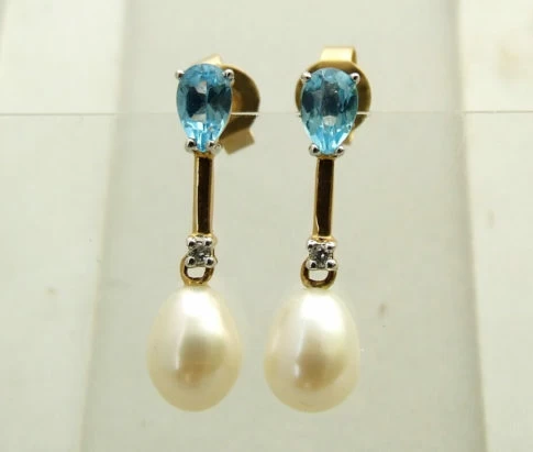 Gouden oorbellen met topaas, diamant en parel