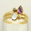 Gouden ring met topaas, amethist en briljant