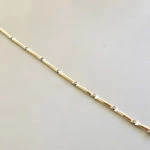 Bicolor Christian gouden schakelarmband