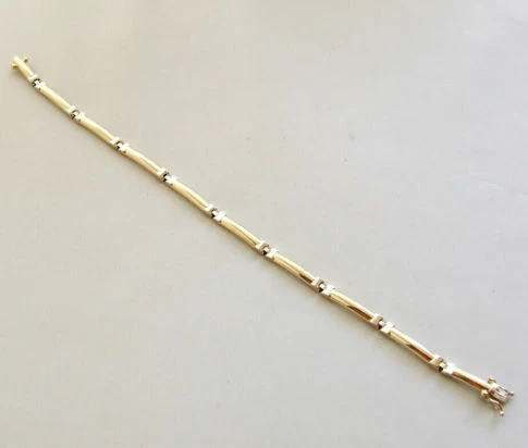 Bicolor Christian gouden schakelarmband