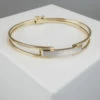 Bicolor gouden schanier armband
