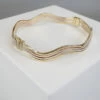 Christian gouden slavenarmband golvend model