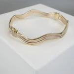 Christian gouden slavenarmband golvend model