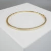 Christian slavenarmband goud