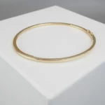 Christian slavenarmband goud