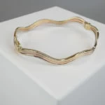 Christian tricolor gouden slavenarmband Christian tricolor gouden slavenarmband