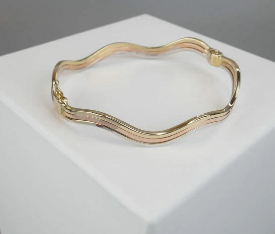 Christian tricolor gouden slavenarmband Christian tricolor gouden slavenarmband