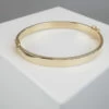 Geel gouden Christian 14 karaat slavenarmband