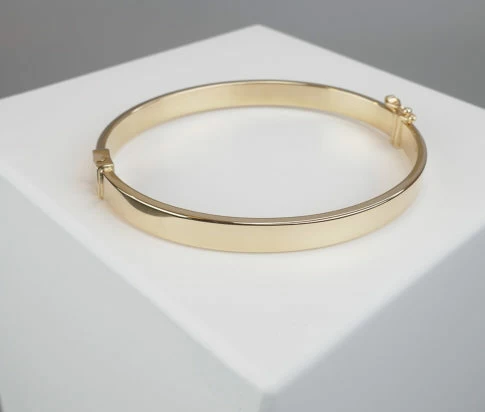 Geel gouden Christian 14 karaat slavenarmband