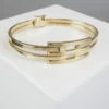 Geel gouden Christian schanier armband