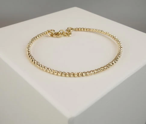 Gouden Christian balletjes armband