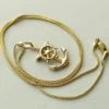 Gouden collier en anker hanger