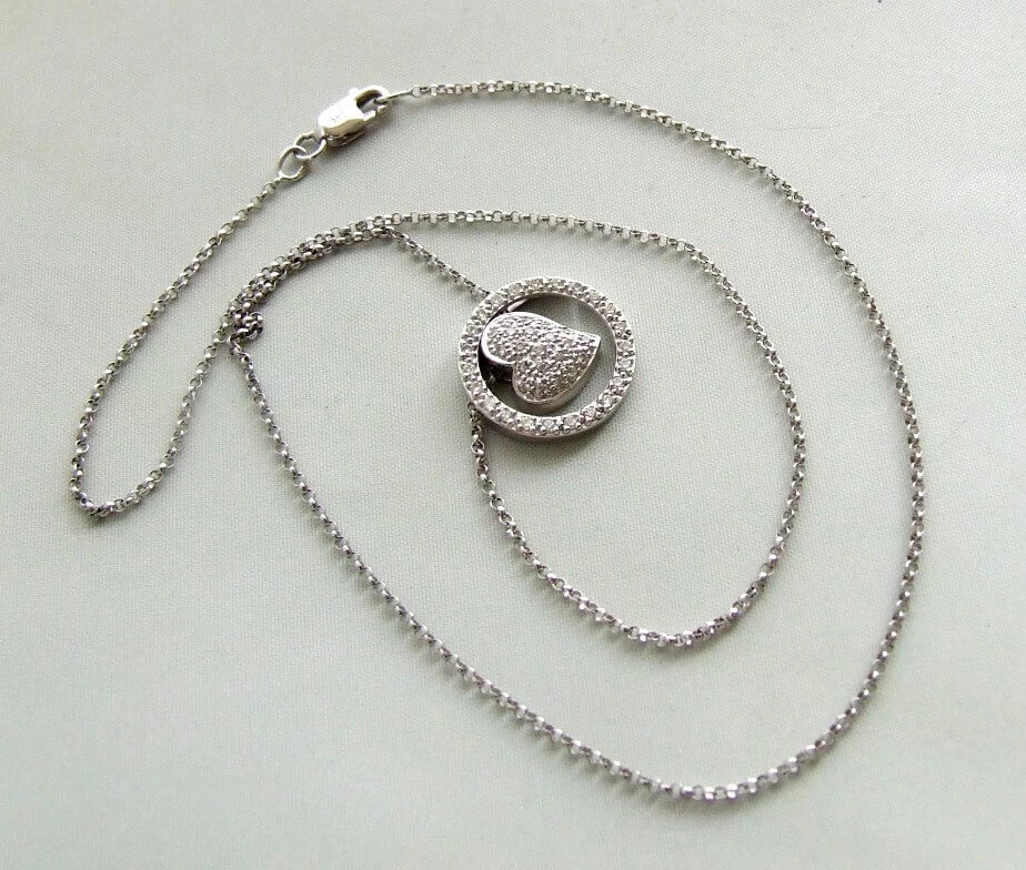 Gouden collier met diamanten harten hanger
