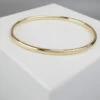 Christian slavenarmband geel goud