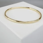 Christian slavenarmband geel goud Christian slavenarmband geel goud