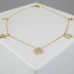Goud enkelband met bedels
