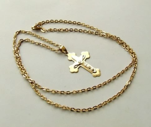 Gouden collier met bicolor kruis