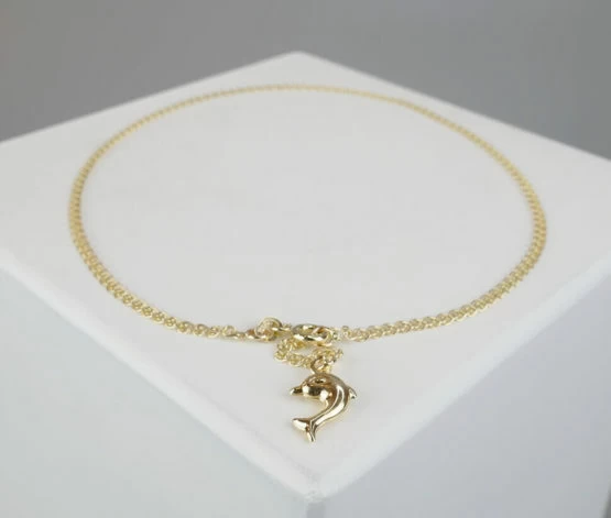Gouden dolfijn enkelband
