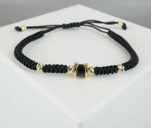 Christian armband met goud en onyx