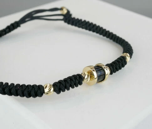 Christian armband met goud en onyx