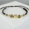 Christian armband met gouden kubus